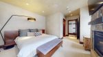 Primary bedroom features King, private fireplace and flatscreen w/ en suite bathroom
